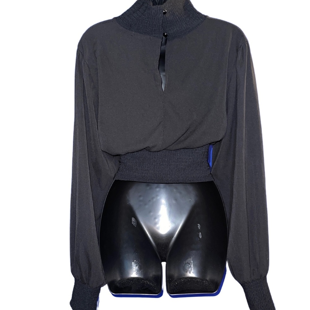 Long sleeve black top with keyhole opening in the front and back